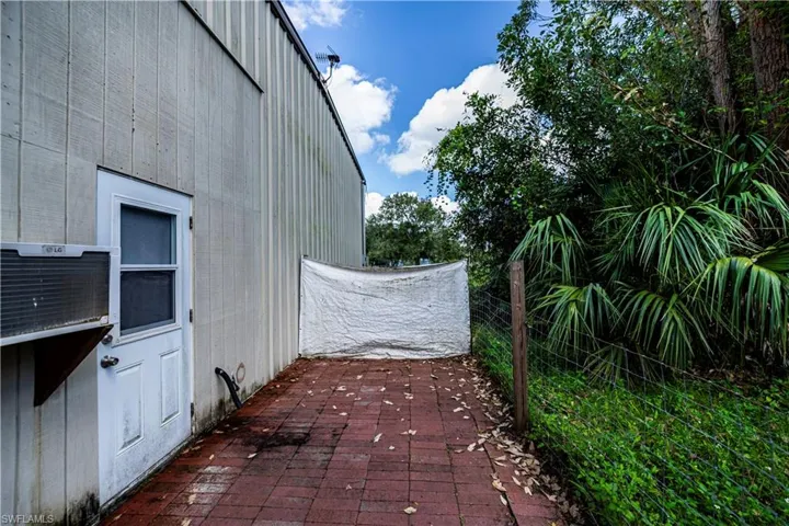 View of property exterior featuring a patio
