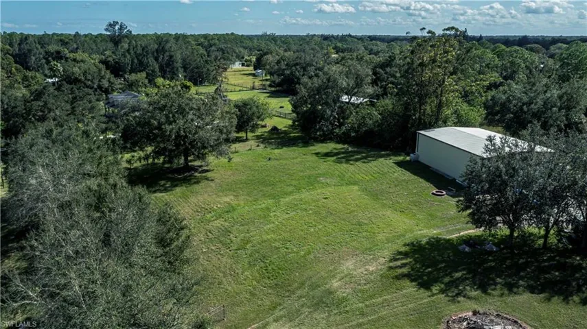 Birds eye view of property with a rural view