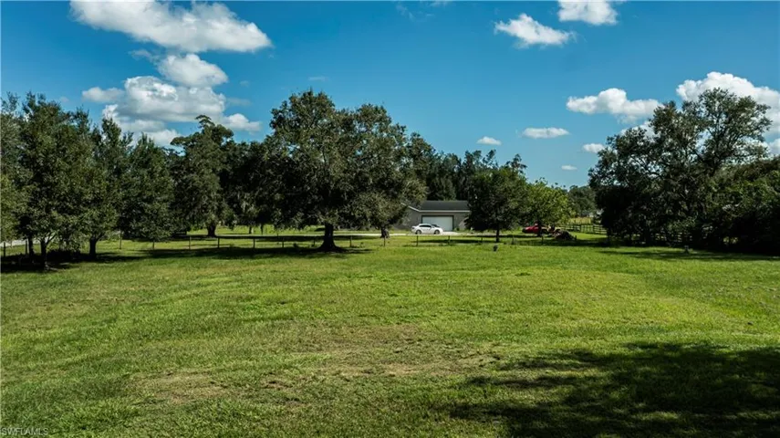 View of yard with a rural view