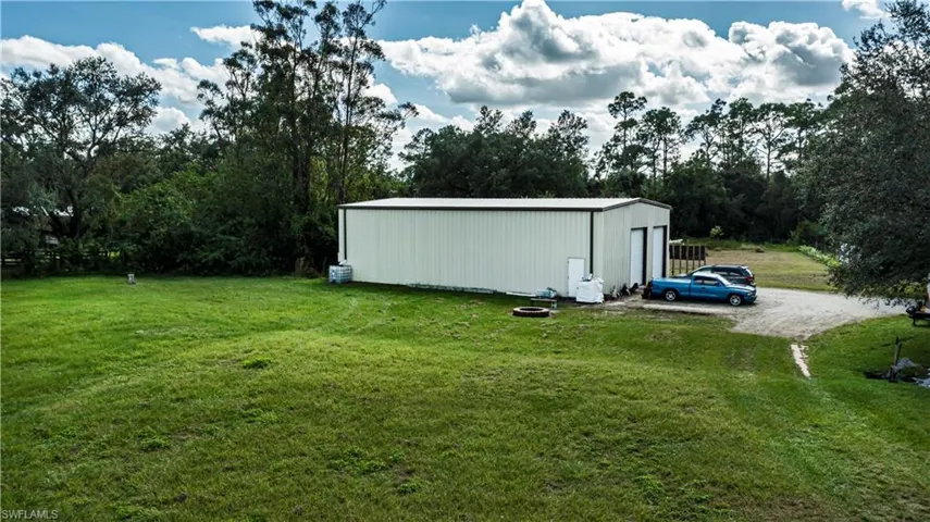 View of yard with an outbuilding