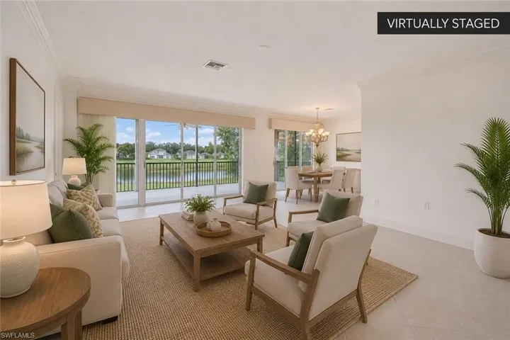 Light-Filled Great Room with Golf & Lake ViewsExpansive open-concept living with walls of glass, seamless access to the screened lanai, and peaceful golf course and water views. (Virtually staged.)