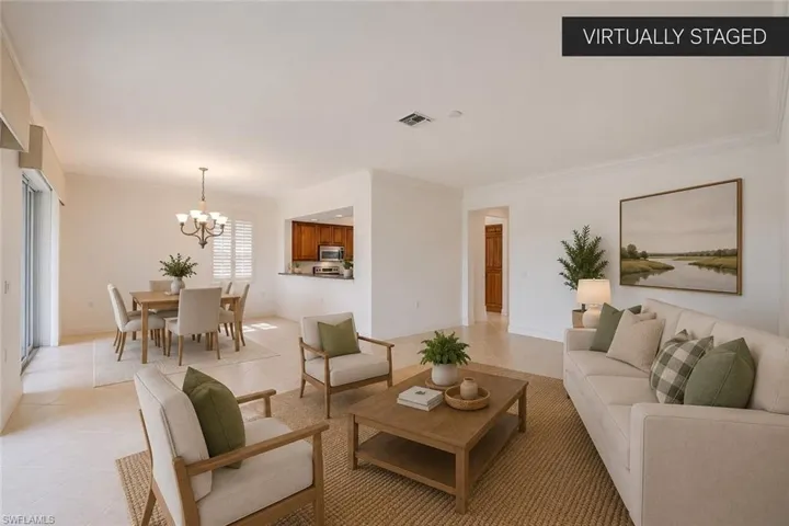 Enjoy an open-concept design that brings together the spacious great room, dining area, and kitchen into one cohesive living space. Filled with natural light and enhanced by crown molding, neutral tile flooring, and an easy flow, this layout is ideal for entertaining while embracing the relaxed Southwest Florida lifestyle. (Virtually staged.)