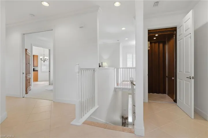 Private Elevator Entry & Welcoming FoyerEnjoy the convenience of private elevator access opening into a spacious foyer with crown molding, elegant finishes, and a thoughtfully designed split-bedroom floor plan.