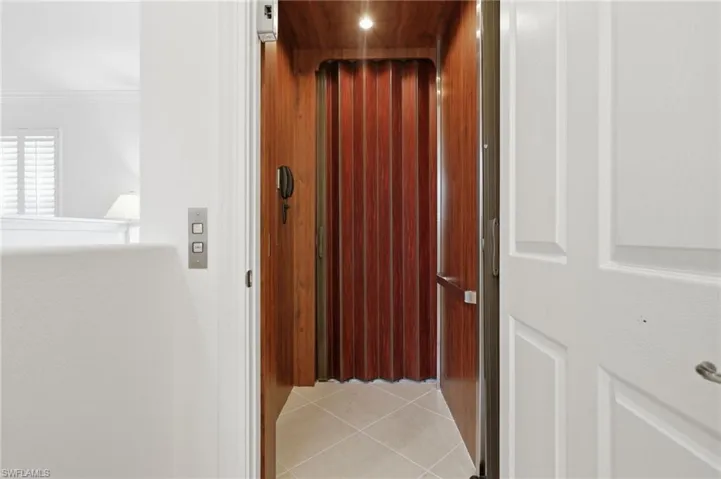 Private Elevator Entry & Welcoming FoyerEnjoy the convenience of private elevator access opening into a spacious foyer with crown molding, elegant finishes, and a thoughtfully designed split-bedroom floor plan.