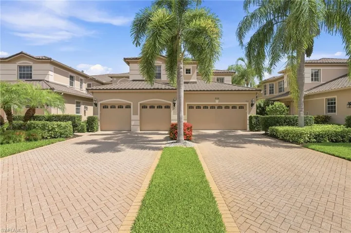 Elegant Mediterranean-inspired architecture and lush tropical landscaping create a stunning first impression at this luxury coach home in the gated community of Regency Reserve at The Vineyards. Complete with an attached 2-car garage, private elevator access, and beautifully maintained brick paver driveway, this residence offers refined Naples living in one of the area's premier golf and country club communities. Optional membership to The Vineyards Country Club provides access to championship golf, tennis,