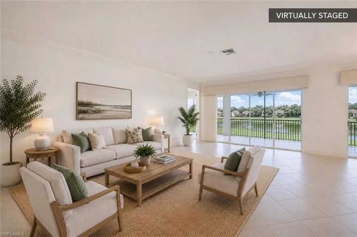 Expansive Great Room with Golf & Lake ViewsOpen-concept living featuring oversized sliding glass doors, abundant natural light, and seamless access to the screened lanai overlooking the golf course and water. (Virtually staged.)