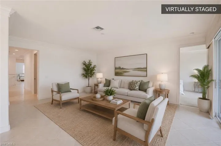 Spacious Great Room with Split-Bedroom DesignAn expansive, light-filled living area featuring crown molding, neutral finishes, and a desirable split-bedroom floor plan for enhanced privacy. (Virtually staged.)
