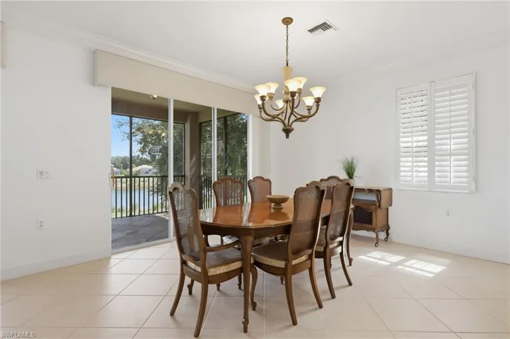 Dining Room with Golf Course ViewsA bright, spacious dining area offering seamless access to the screened lanai, an open connection to the kitchen, and peaceful golf course views—perfect for entertaining and everyday dining.