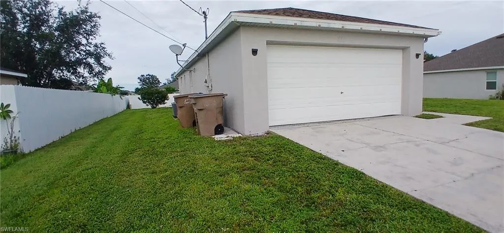 Garage with concrete driveway