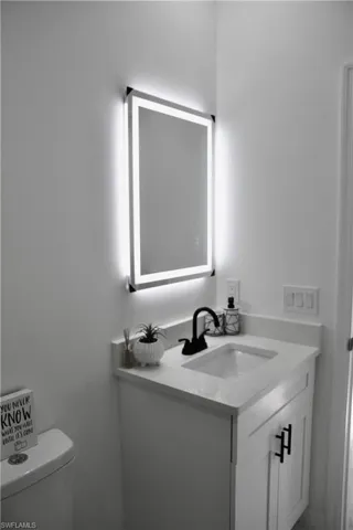Half bath with toilet and vanity