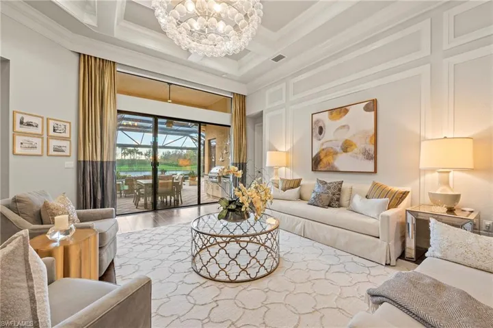 4056 Nova Ln. Naples FL 34119 - Living room with slider access to lanai and pool deck