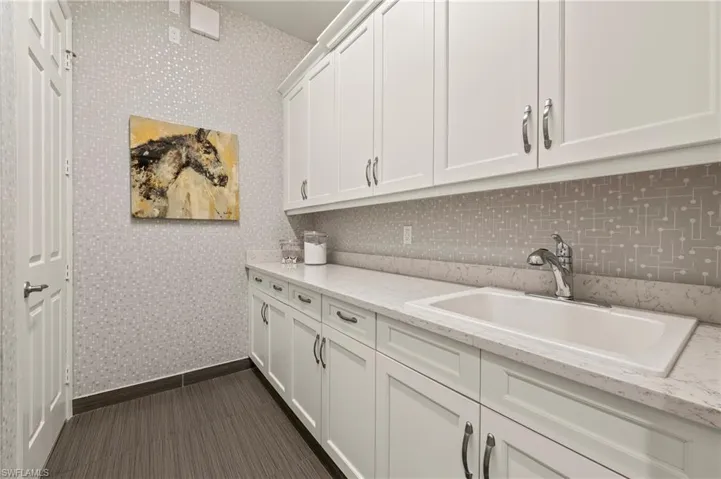 4056 Nova Ln. Naples FL 34119 - Laundry room with utility sink
