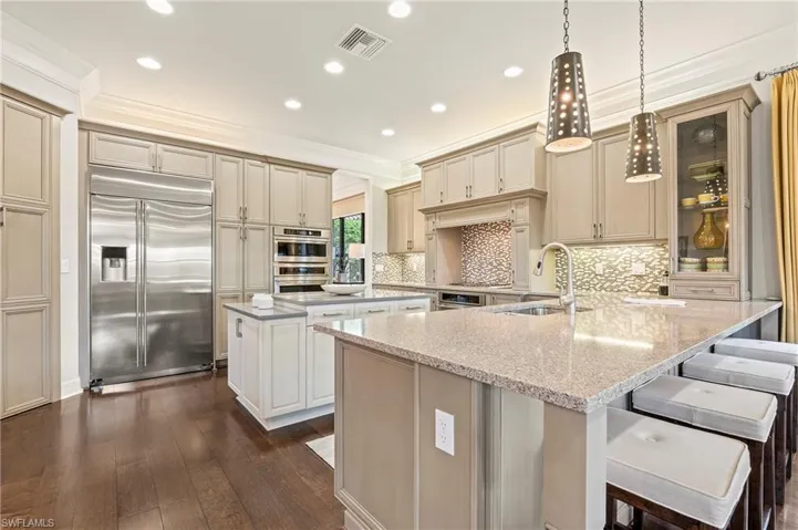 4056 Nova Ln. Naples FL 34119 - Kitchen with maple cabinet, working island, "built in" 42" refrigerator