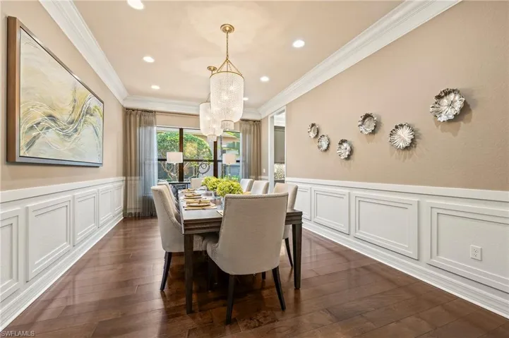 4056 Nova Ln. Naples FL 34119 - Dining room with crown moulding, additional recessed lighting, and wainscoting