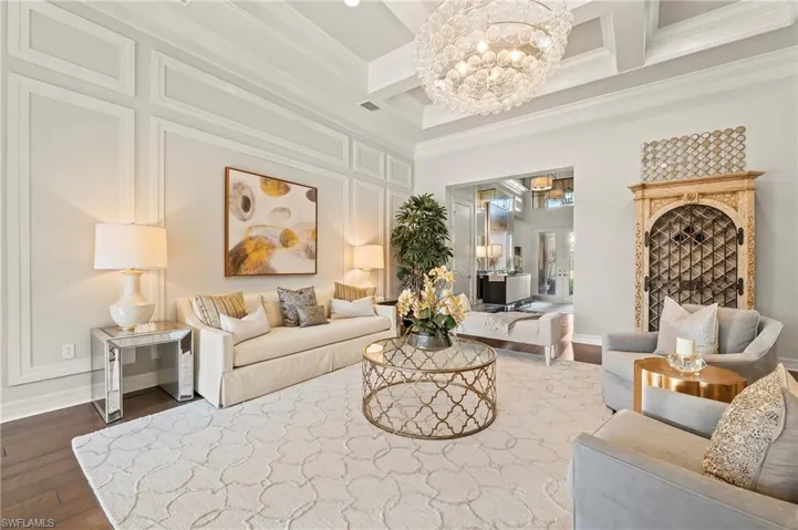 4056 Nova Ln. Naples FL 34119 - Living room with coffered ceilings and neutral decor