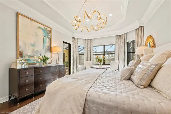 4056 Nova Ln. Naples FL 34119 - Owner's bedroom with view of pool deck and lake beyond