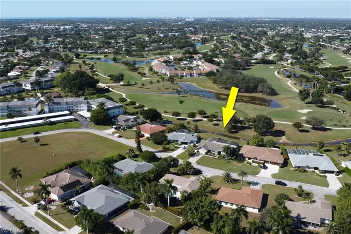 Aerial overview of property's location featuring nearby suburban area