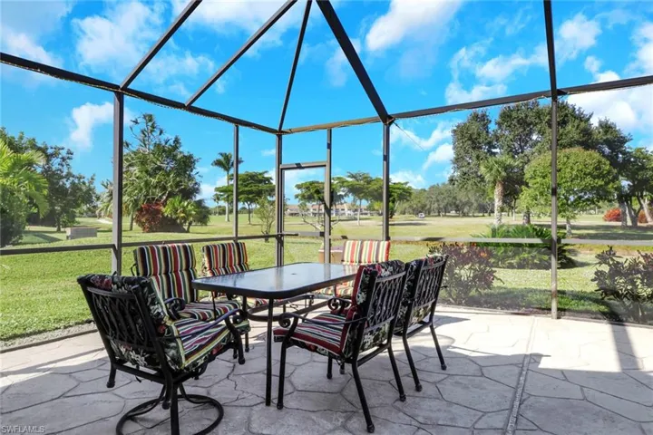 Sunroom featuring outdoor dining area, a patio area, and healthy amount of natural light