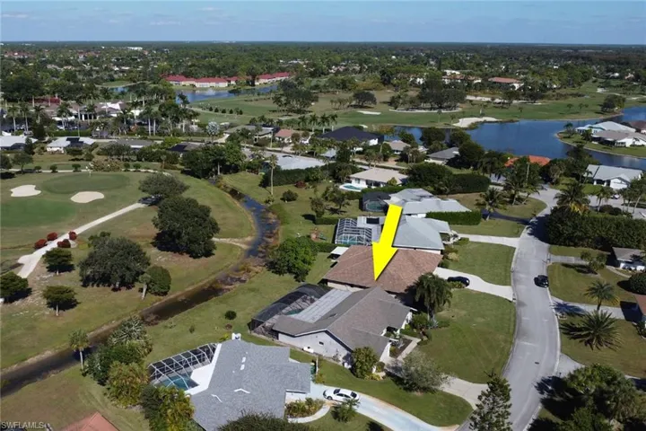 View of property location featuring nearby suburban area and a local golf course