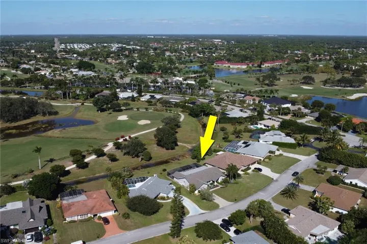 View of property location featuring nearby suburban area and a local golf course