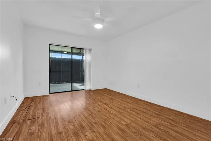 First Floor Master Bedroom wood finished floors and a ceiling fan