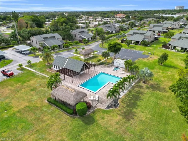 Aerial perspective of suburban area with a pool