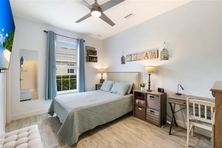 Bedroom featuring light wood finished floors and ceiling fan
