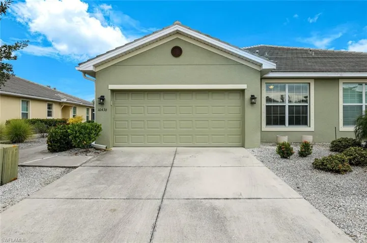 Ranch-style home with stucco siding, concrete driveway, and a garage
