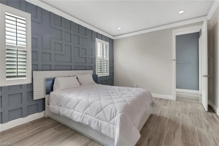Guest bedroom with custom millwork.  The full bath doubles as a pool bath.