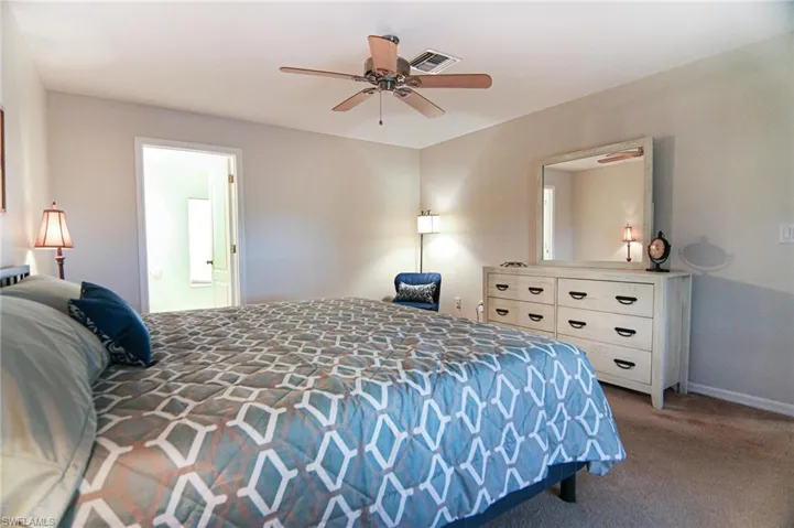Bedroom featuring carpet flooring and ceiling fan