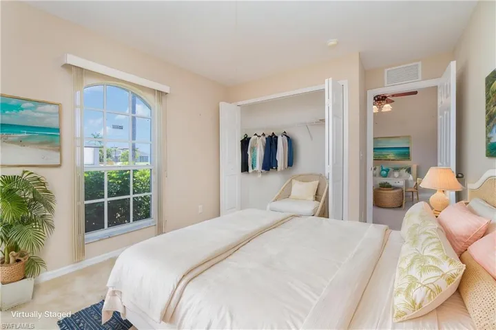 Bedroom featuring a closet, carpet flooring, and baseboards