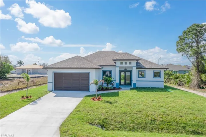 View of front facade with an attached garage, concrete driveway, roof with shingles, stucco siding, and a front lawn