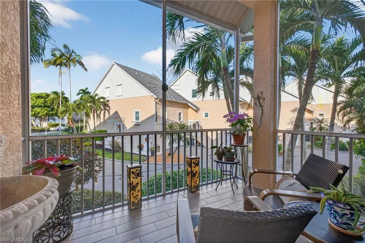 Balcony featuring a sunroom