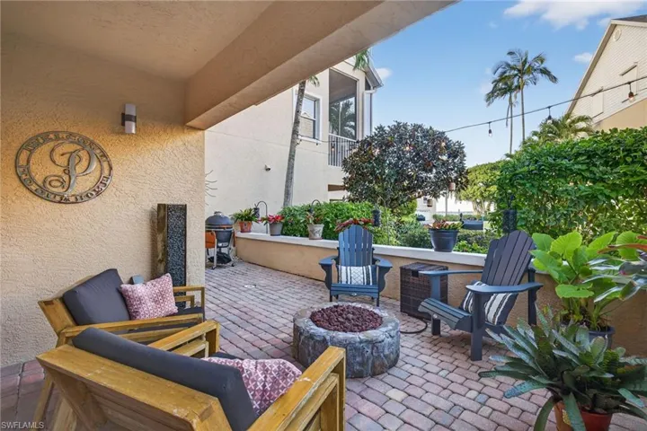 View of patio / terrace featuring a fire pit and a grill