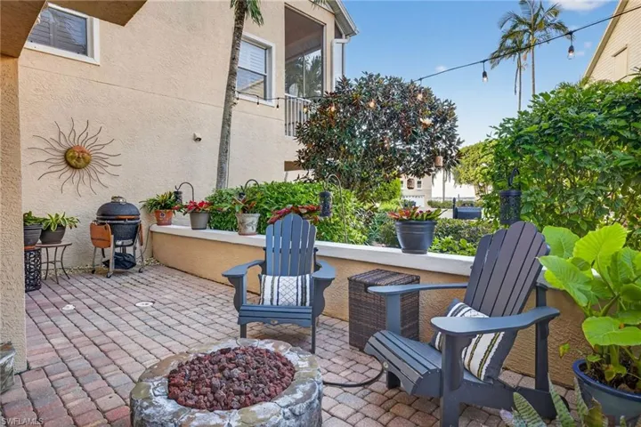 View of patio / terrace with a fire pit and area for grilling