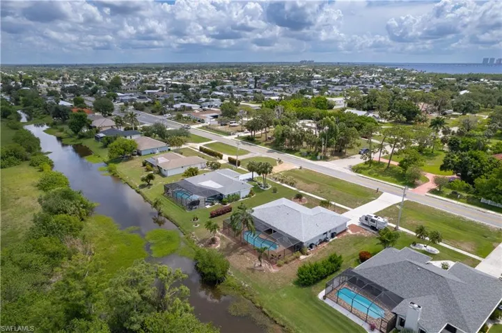 Aerial perspective of suburban area with a large body of water