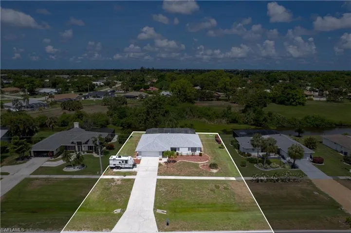 Aerial view of residential area with property boundaries highlighted
