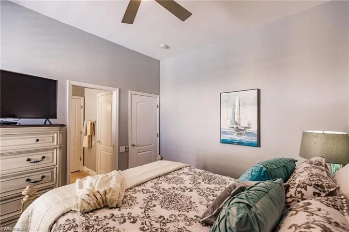 Bedroom 3 featuring a ceiling fan, tv, roku, carpet