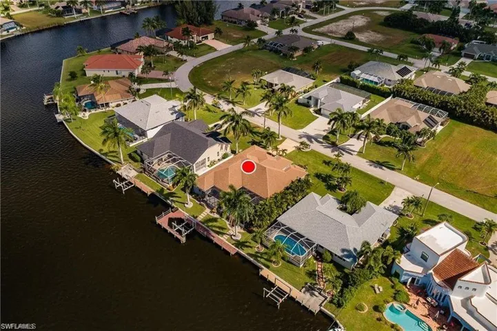 View of property location featuring nearby suburban area and a nearby body of water