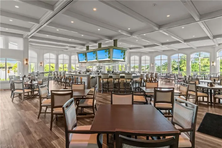 Dining space featuring beamed ceiling, coffered ceiling, wood finished floors, and recessed lighting