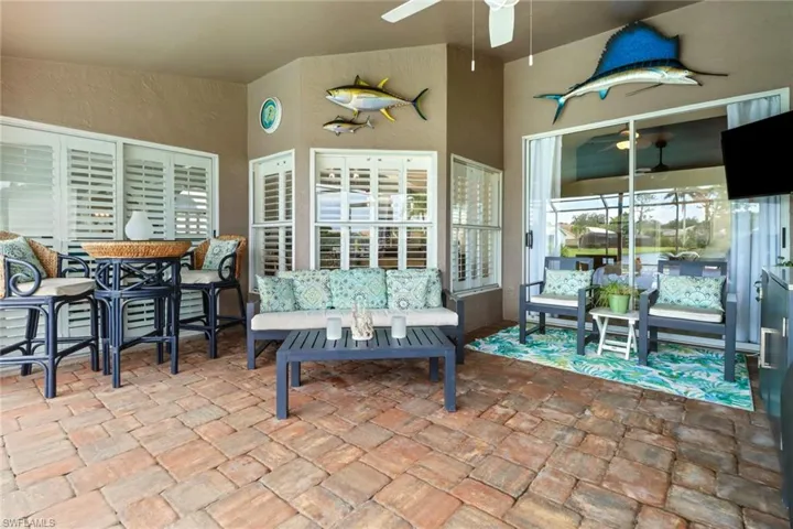 View of patio featuring a ceiling fan