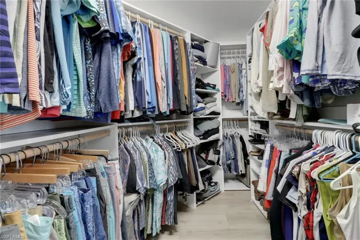 Walk in closet featuring light wood-type flooring