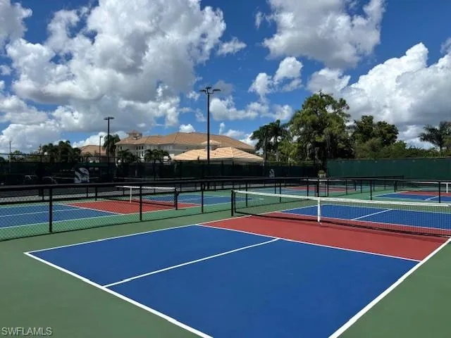 View of tennis court with community basketball court