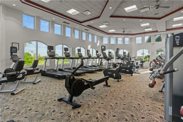 Exercise room featuring a high ceiling