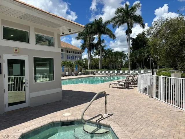 Community pool with a patio and a community hot tub