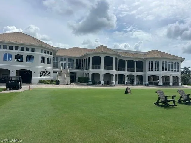 Back of house featuring a yard