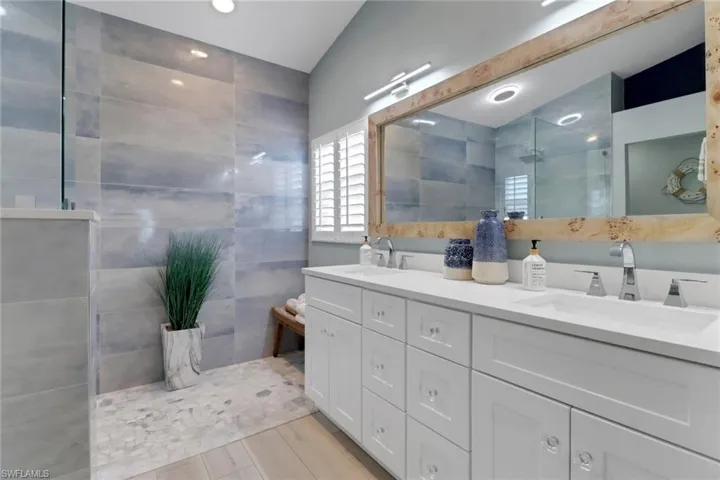 Bathroom with walk in shower and double vanity