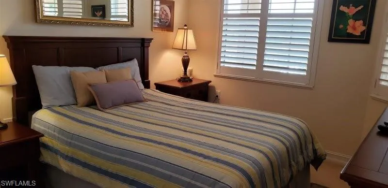 Bedroom featuring multiple windows
