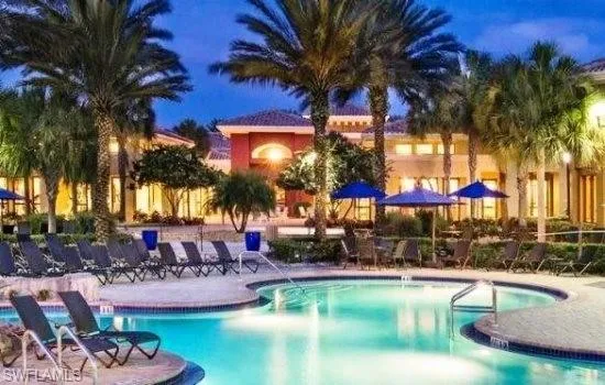 Community pool with a patio area