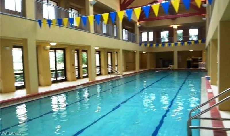 Indoor pool featuring a patio area